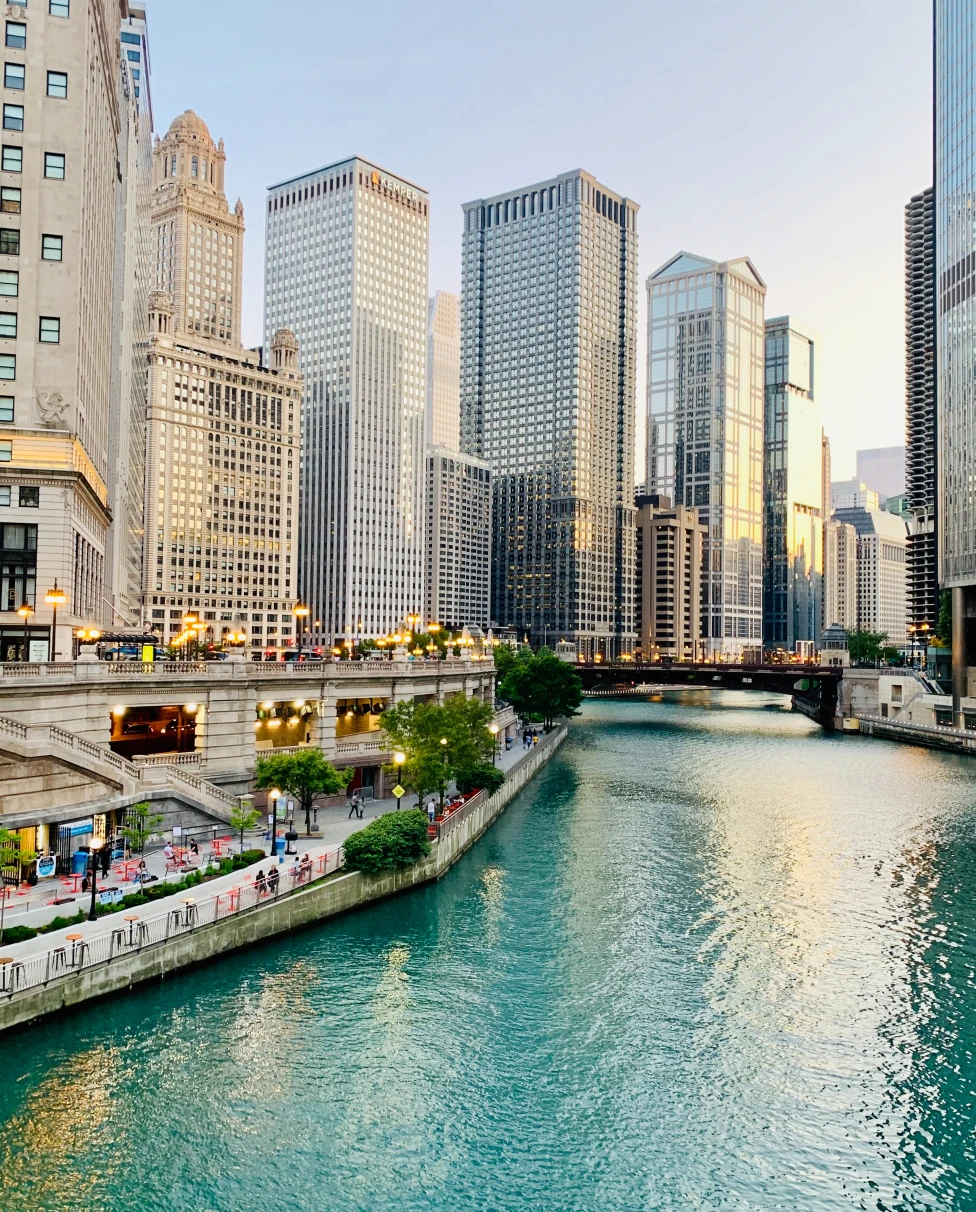 Body of water lined with tall buildings during daytime