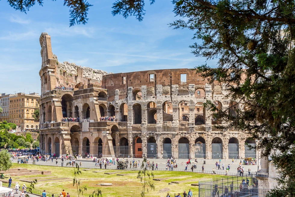 people walking outside ancient building during daytime