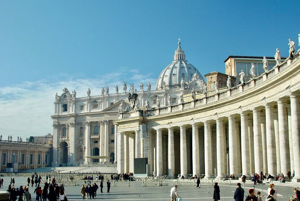 ancient chapel with columns and a plaza on a clear blue day