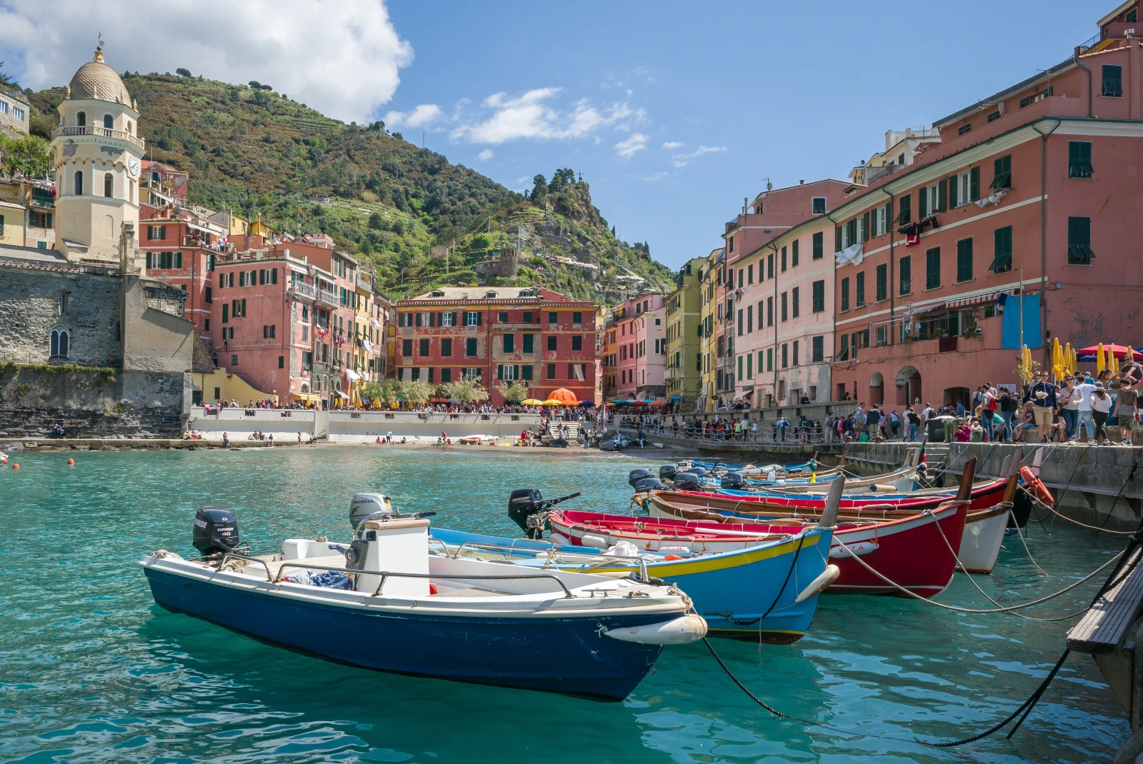 Colorful boats in water in Cinque Terre.