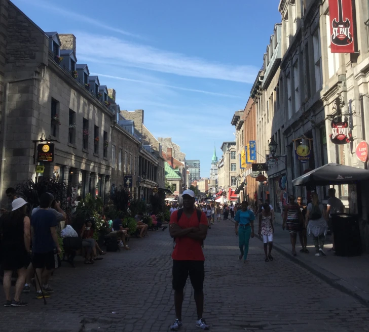 man stands on long market street