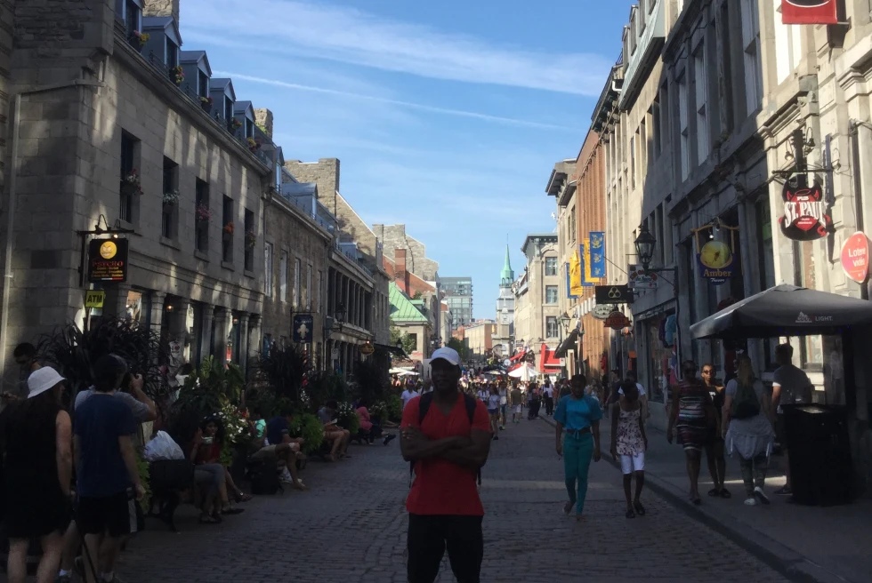 man stands on long market street