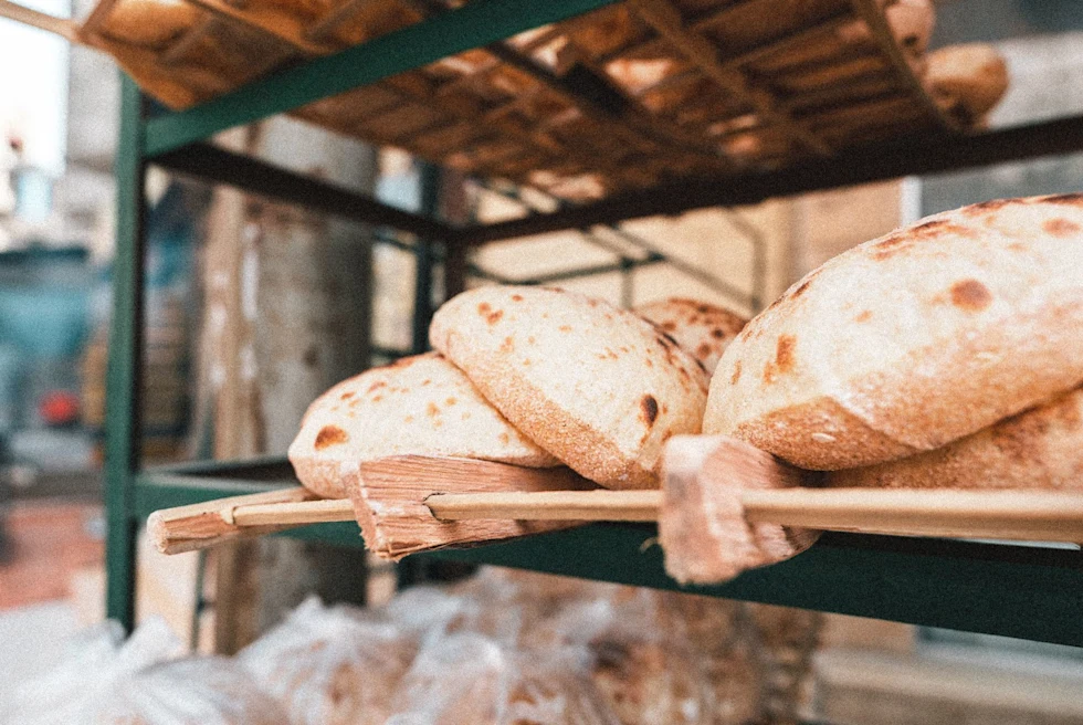 fresh flatbread on a wooden tray from a street market
