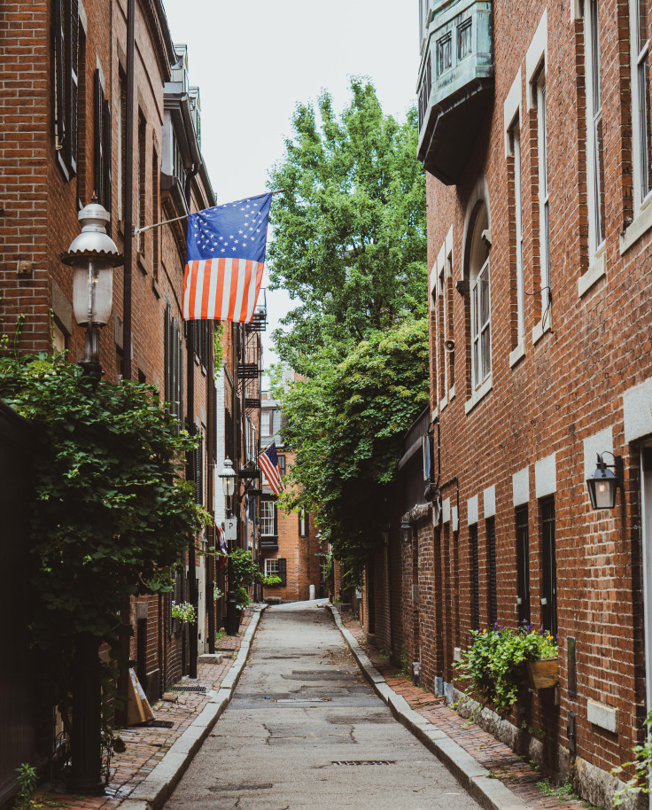 Street lined with brick buildings during daytime