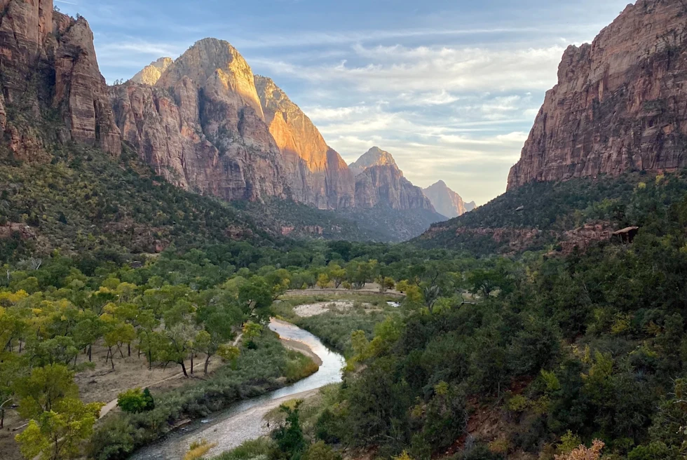 winding blue river through a desert canyon valley