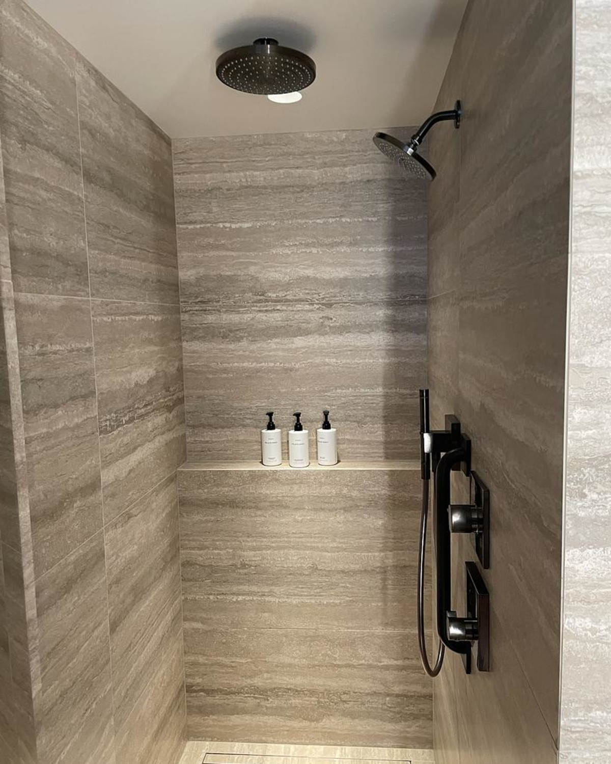 bathroom with shower and essentials