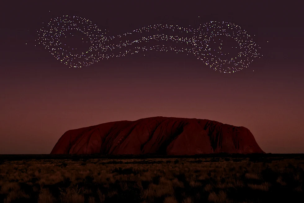Star Lights over a brown dome mountain.