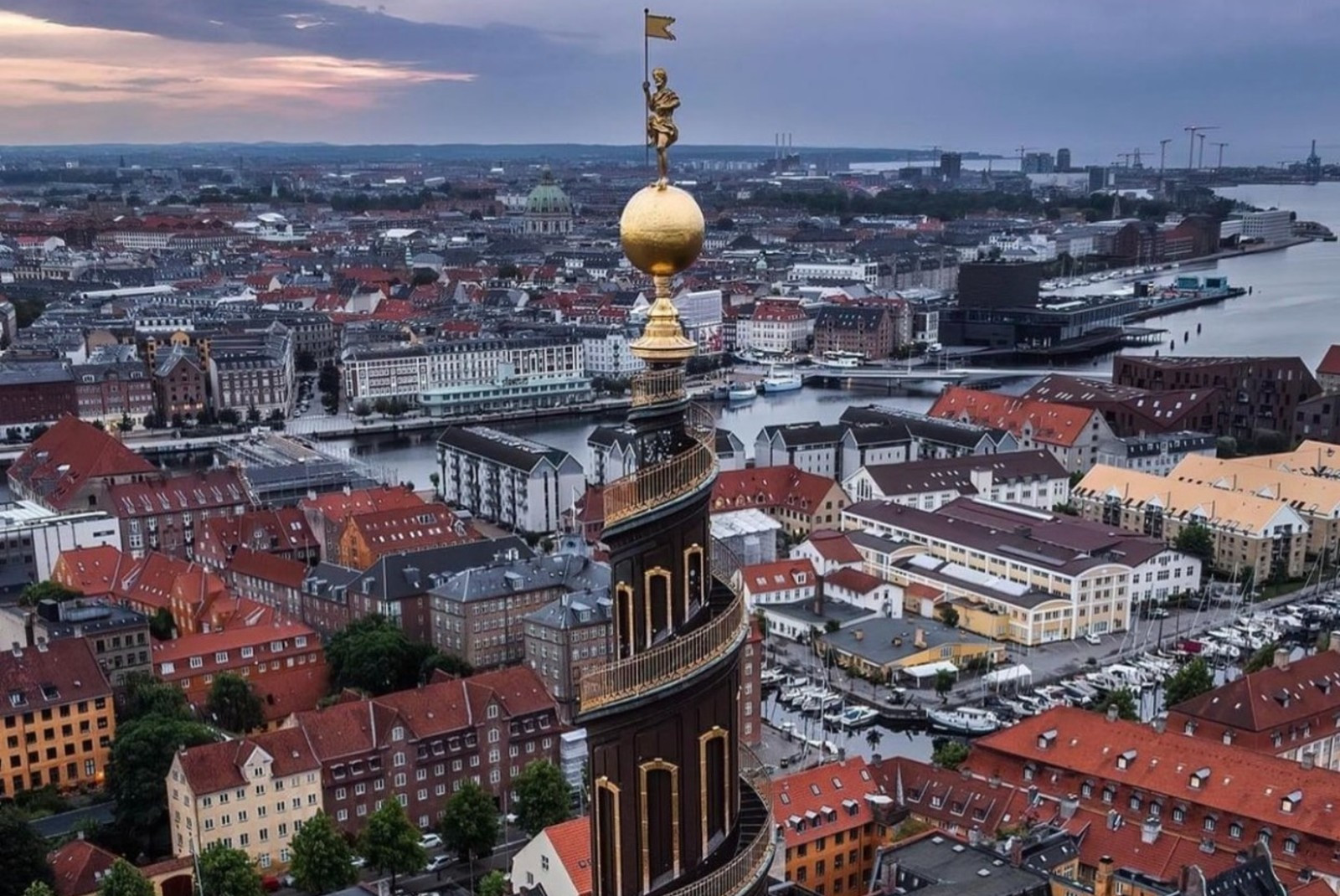 Twisted spire of the Church of Our Savior in Copenhagen at dusk.