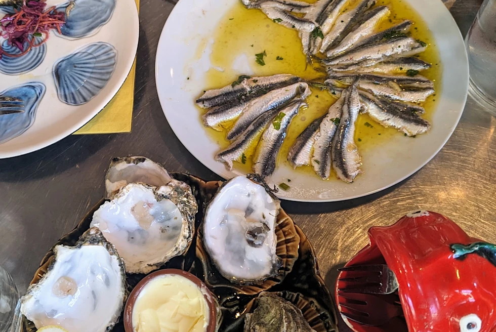 Dishes with oysters and other fish.