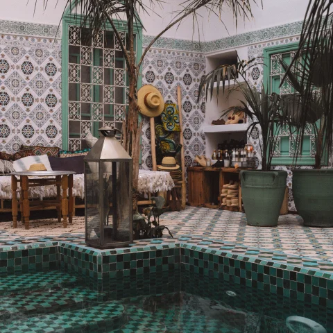 Riad in Morocco with intricate tiling and a pool
