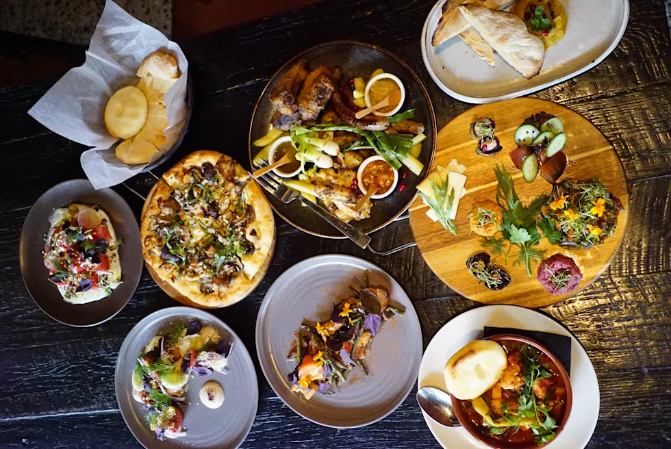 Supra is a restaurant serving Georgian khachapuri breads, garlicky chicken, wines & cocktails in a folk art-filled, rustic-mod hub.