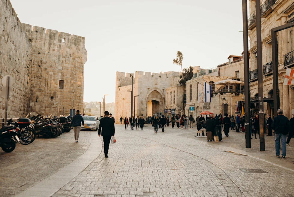 cobblestone street lined with buildings during daytime