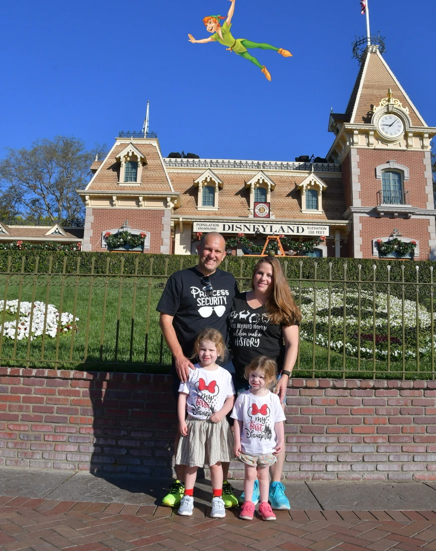 Family photo in front of Disney land 