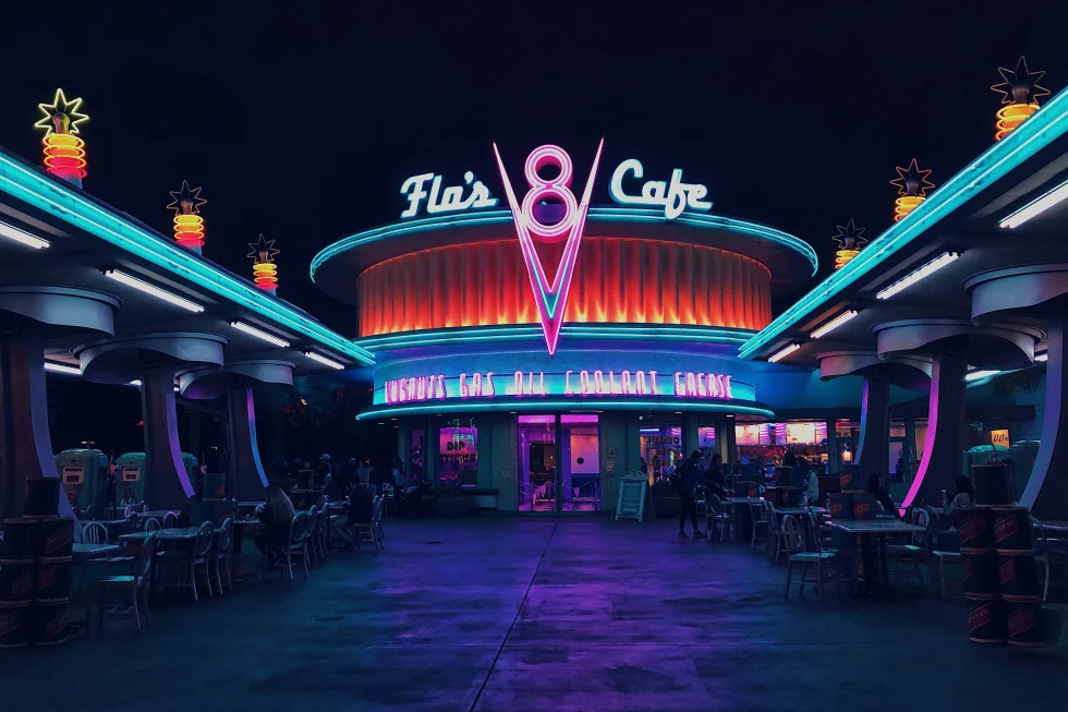 A cafe's front lighting with neon signs