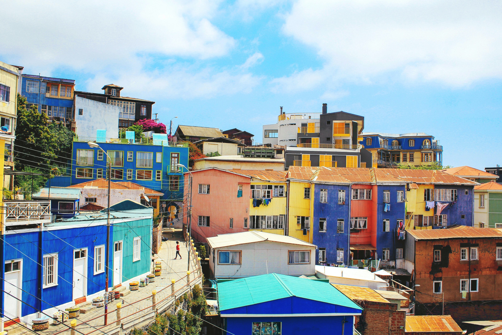 Colorful houses next to a walking path during daytime