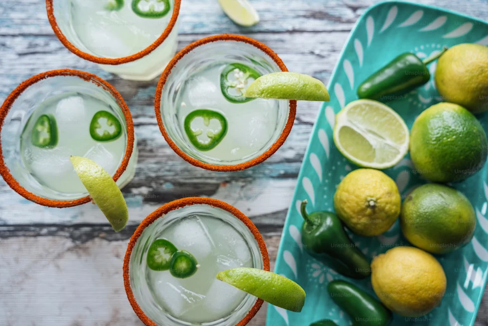 Margaritas with a spicy rim and fresh limes.