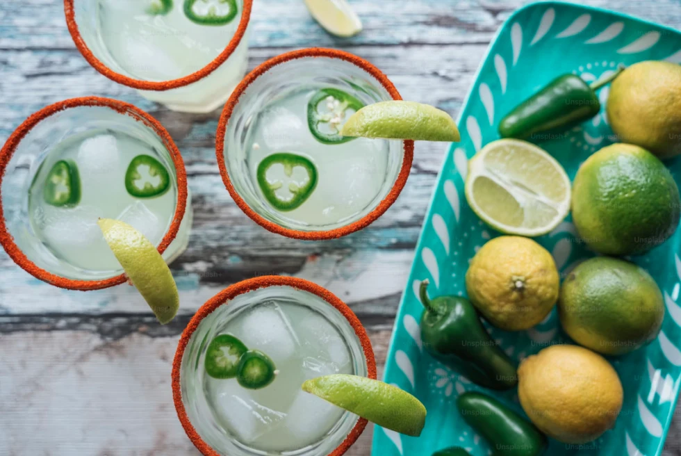 Margaritas with a spicy rim and fresh limes.