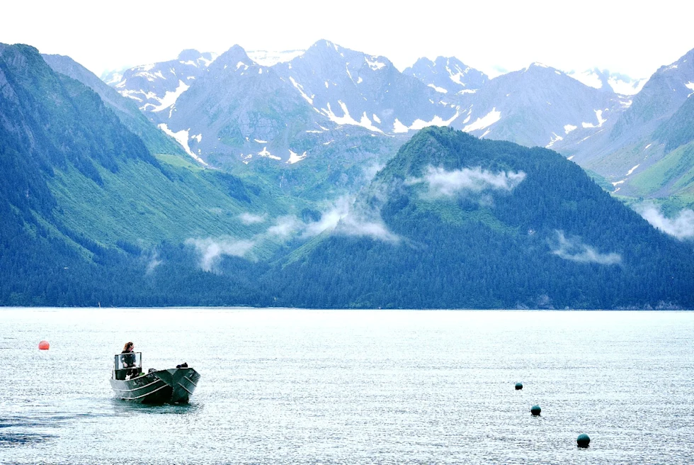 small motor boat in a mountainous snowy region