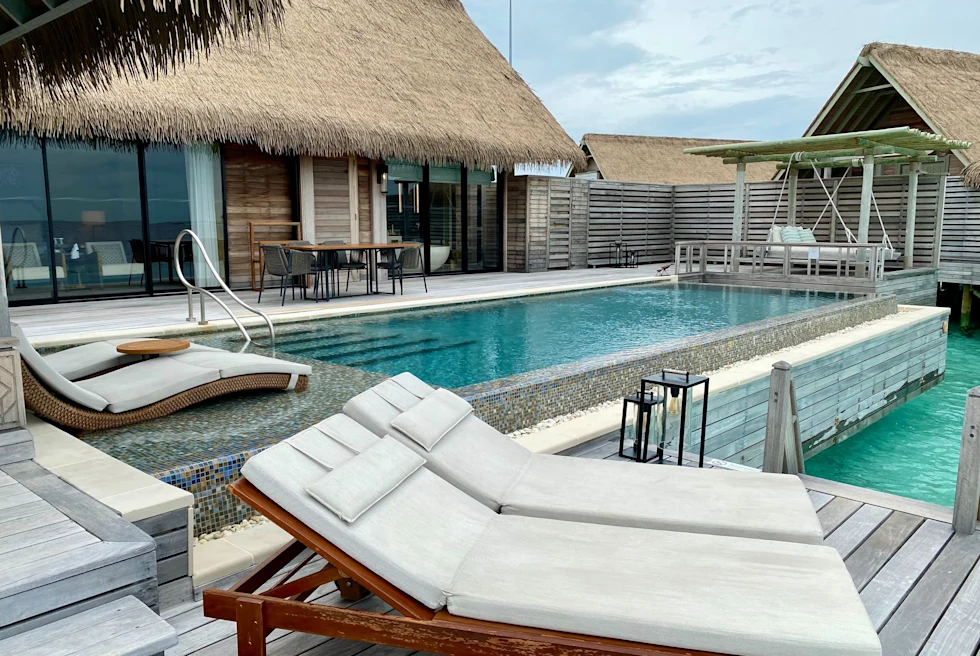 lounge chairs on a fancy pool deck