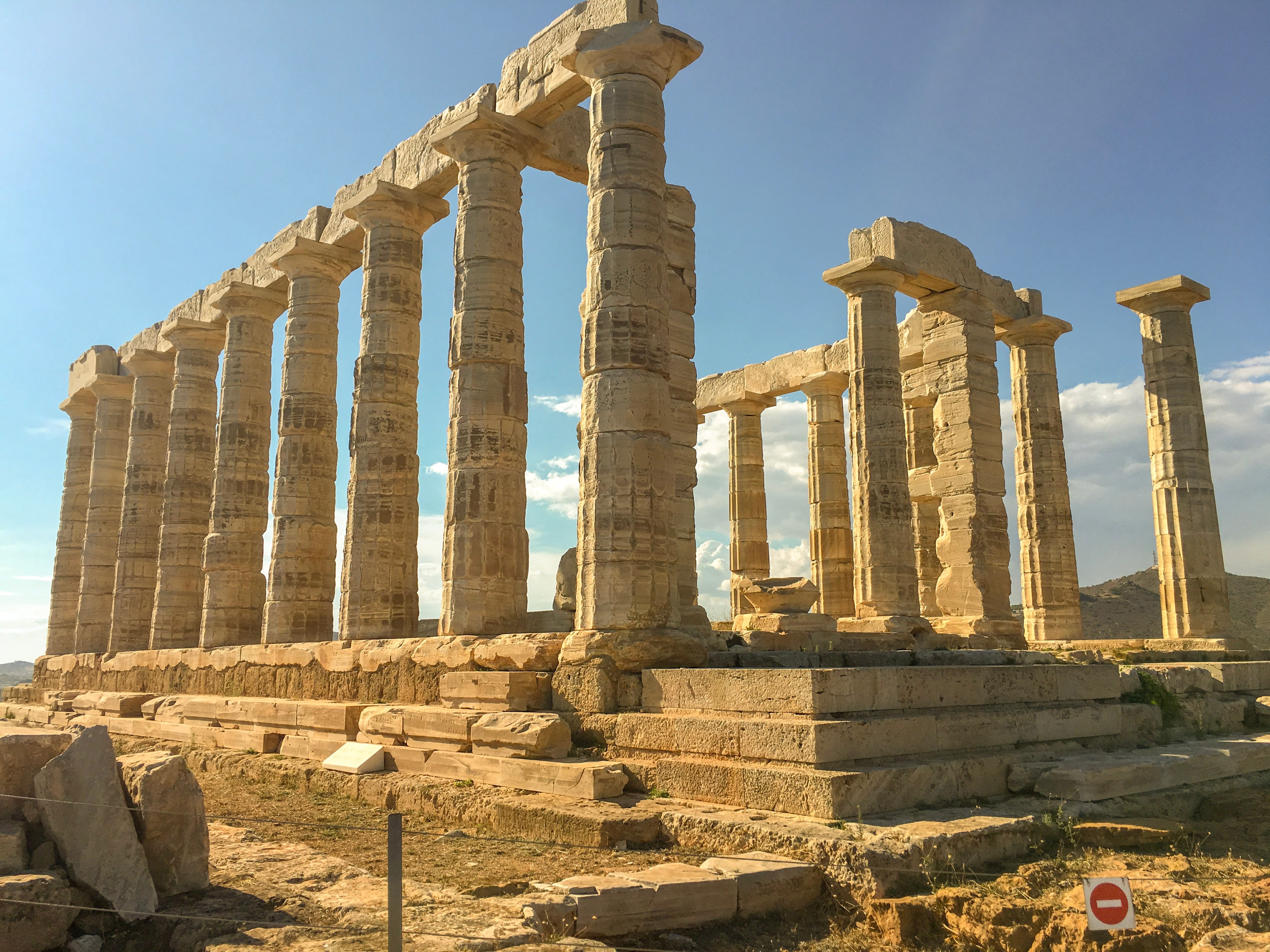 A building ruin with pillars on a sunny day.