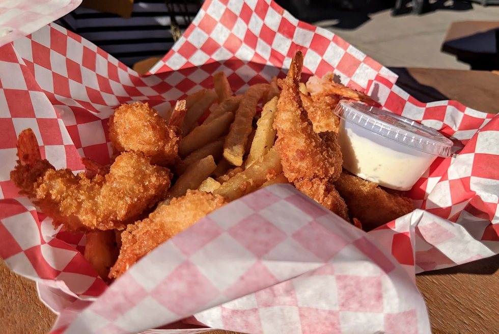 Fish and chips on a checkered paper.