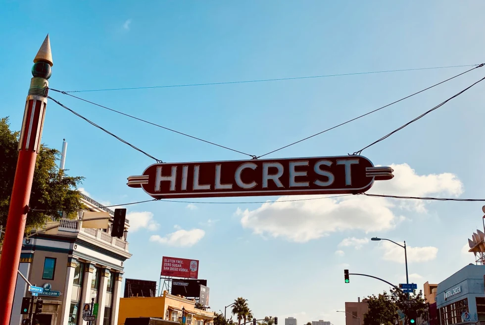 sign reads, Hillcrest, over city street