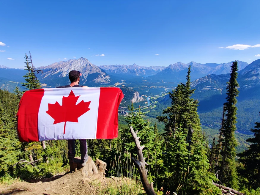 Canadian flag in the mountains. 