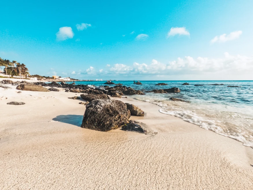 White sand beach and blue ocean with blue skies in Aruba