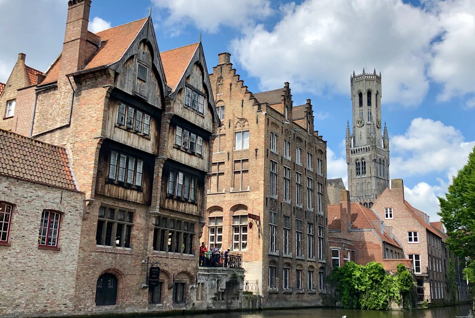 A high rise building in a river passing through the street