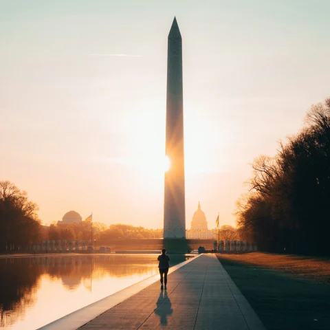 A picture of Washington Monument taken during the sunrise