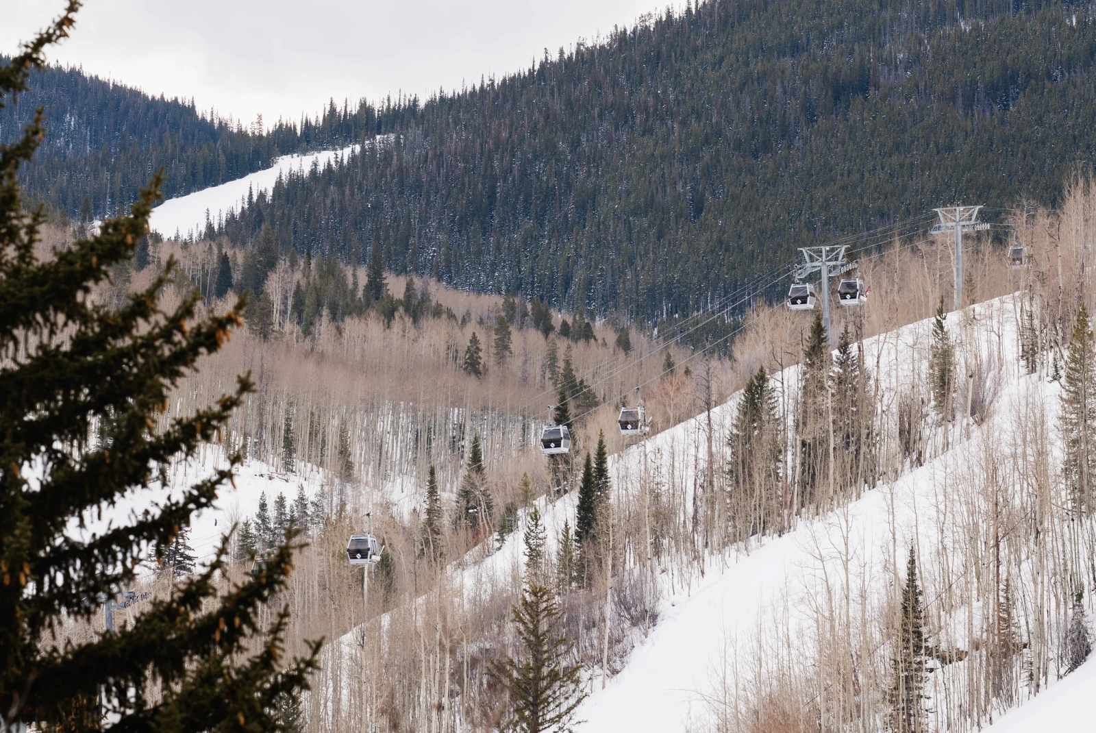 snowy mountain with ski lift 