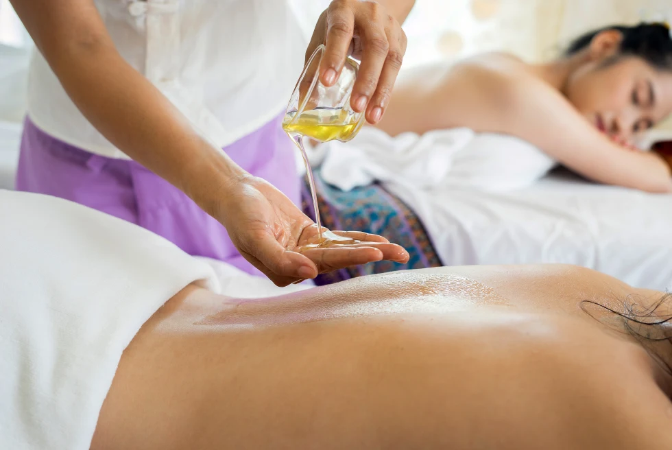 Two women receiving a massage. 