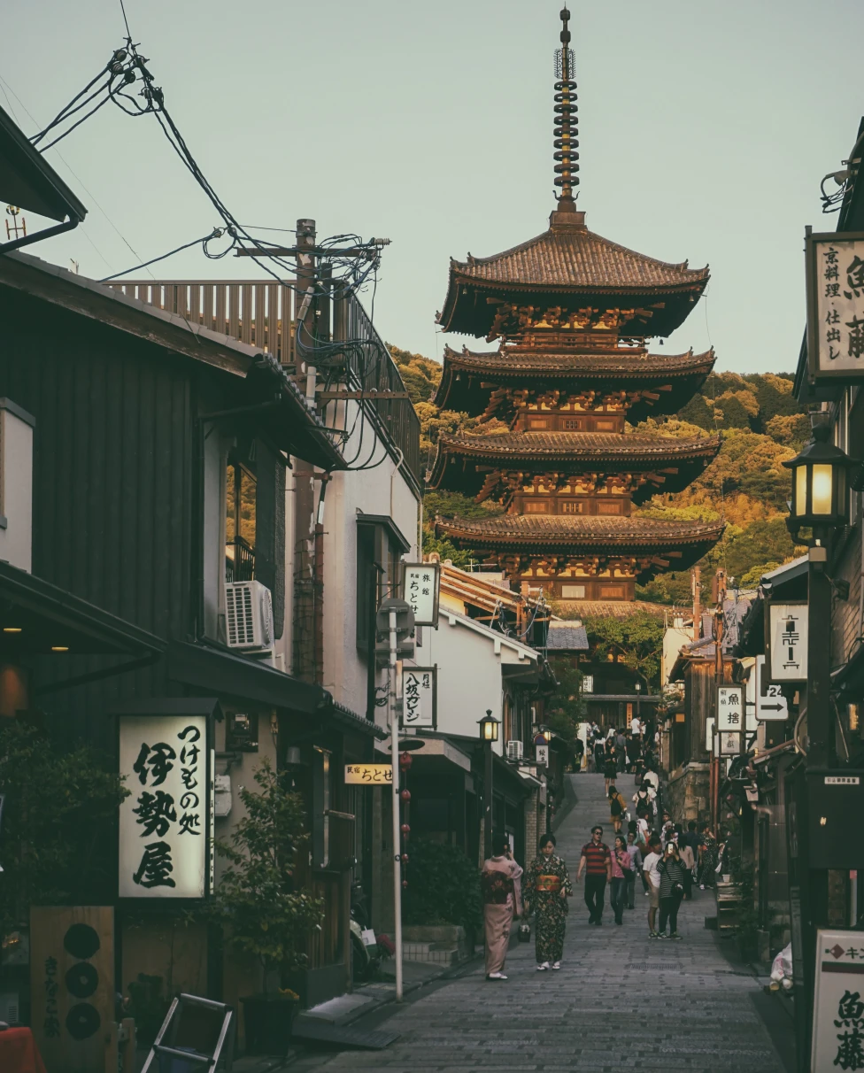 street lined with buildings with temple in the background