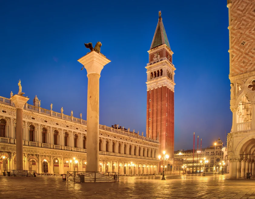 venice italy piazza san marco square at night blue sky and red tan buildings
