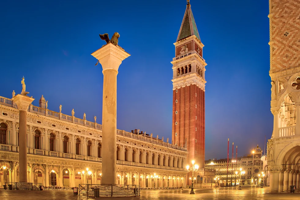 venice italy piazza san marco square at night blue sky and red tan buildings
