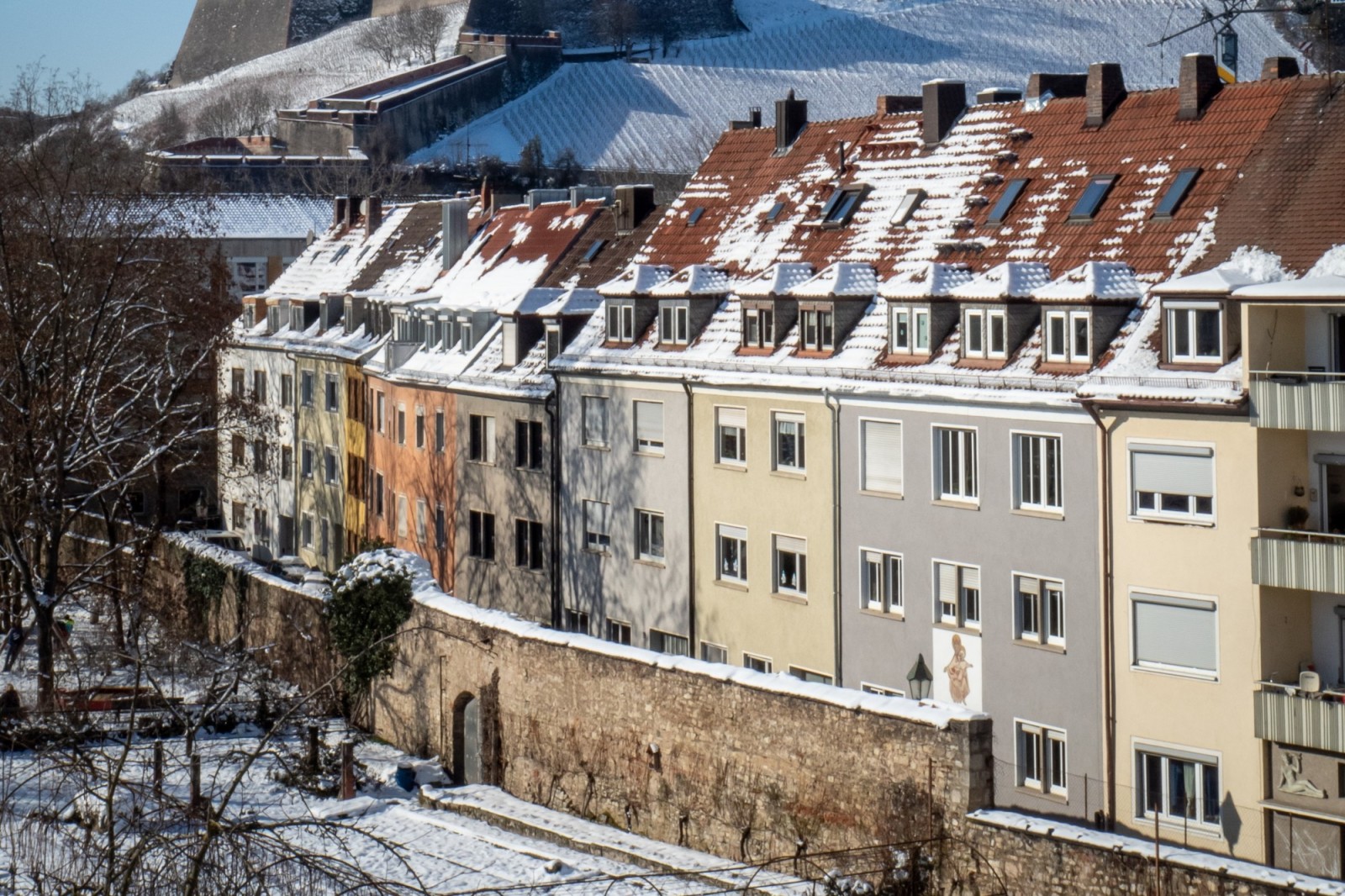 Buildings with snow covered roofs in Wurzburg, Germany.