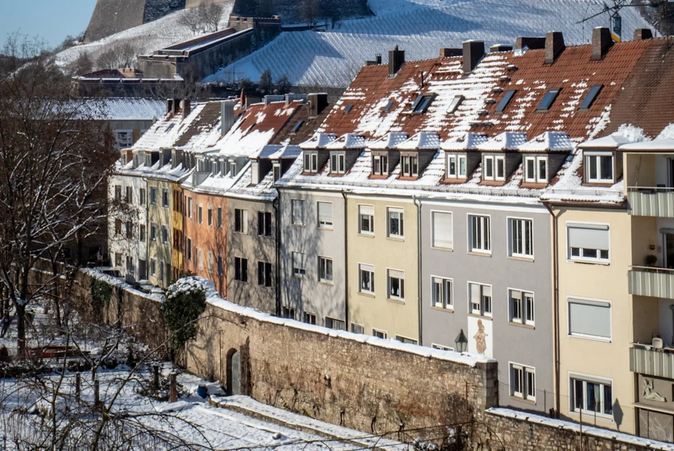 Buildings with snow covered roofs in Wurzburg, Germany.