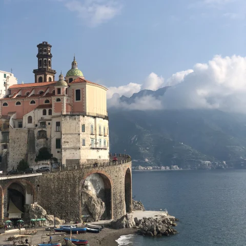 The Amalfi Coast is a breathtaking Italian paradise, characterized by stunning cliffs, charming villages, and the sparkling azure waters of the Tyrrhenian Sea.