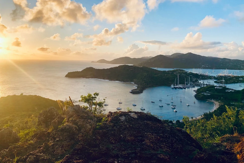 view of island with a harbor at sunset
