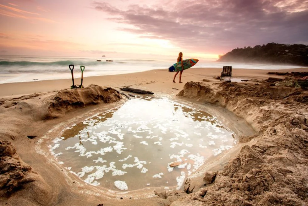 A beach with a separate small water body.