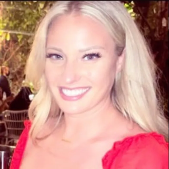 Travel Advisor Hannah Kimball smiling in a red dress