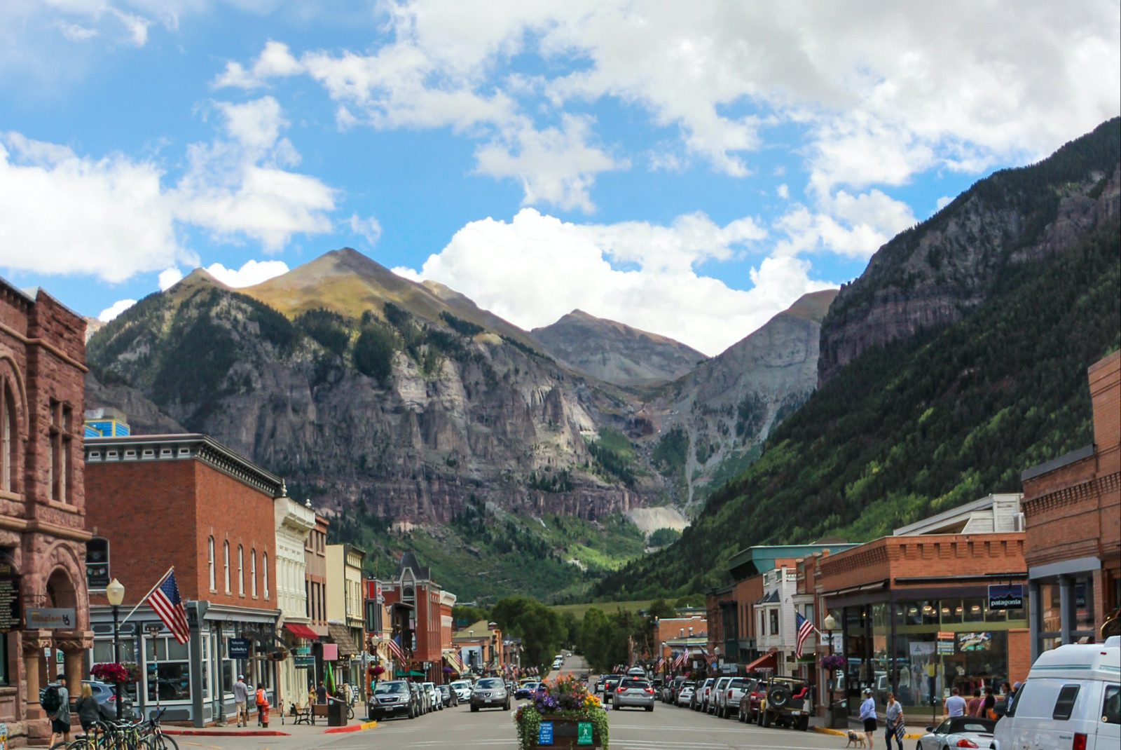 Street lined with buildings with mountains in the background