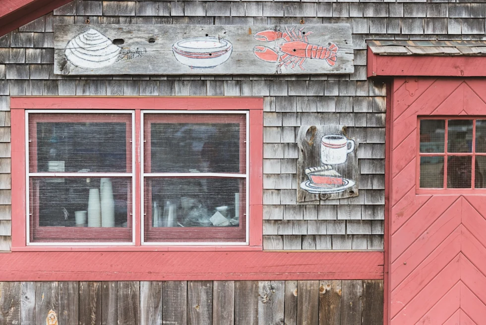 old seaside shack with red shutters