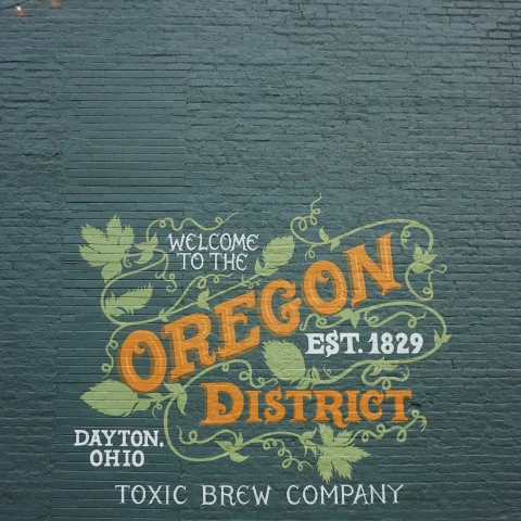 A picture of a painted wall saying Oregon District, Dayton, Ohio.