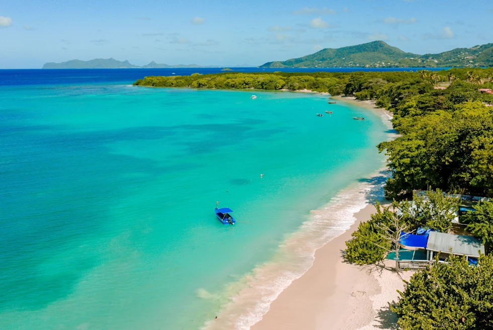 turquoise lagoon flanked by a white-sand beach