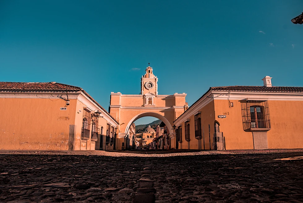 pink orange building with red roof in Guatemala