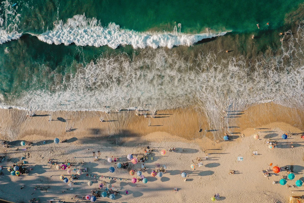 Beautiful blue beach with surfers in Sayulita, Mexico.