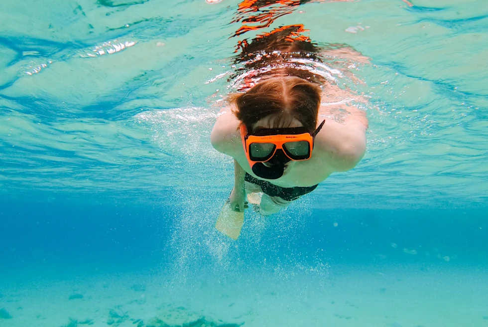 Person snorkels under the water in St. John