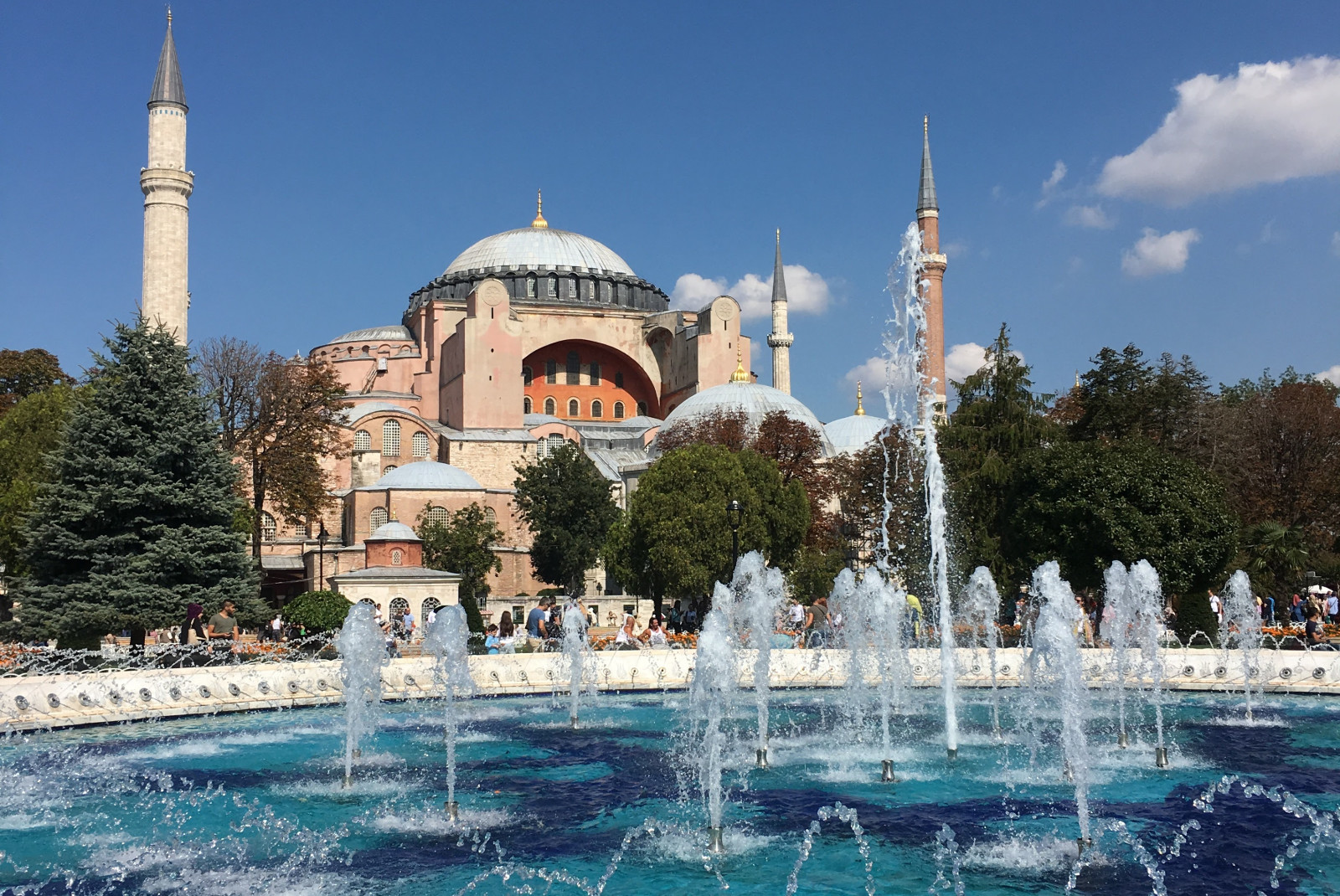 fountain with building in the background during daytime