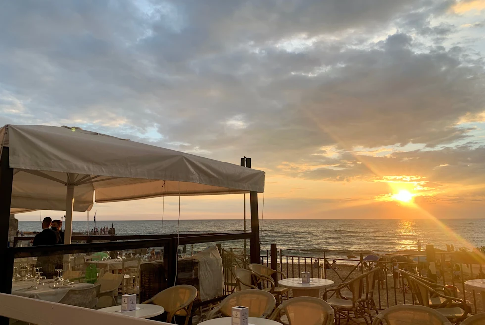 White tent outside at sunset.